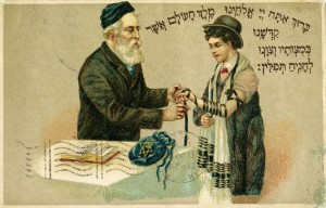 Postcard showing a young boy learning to wear tefillin